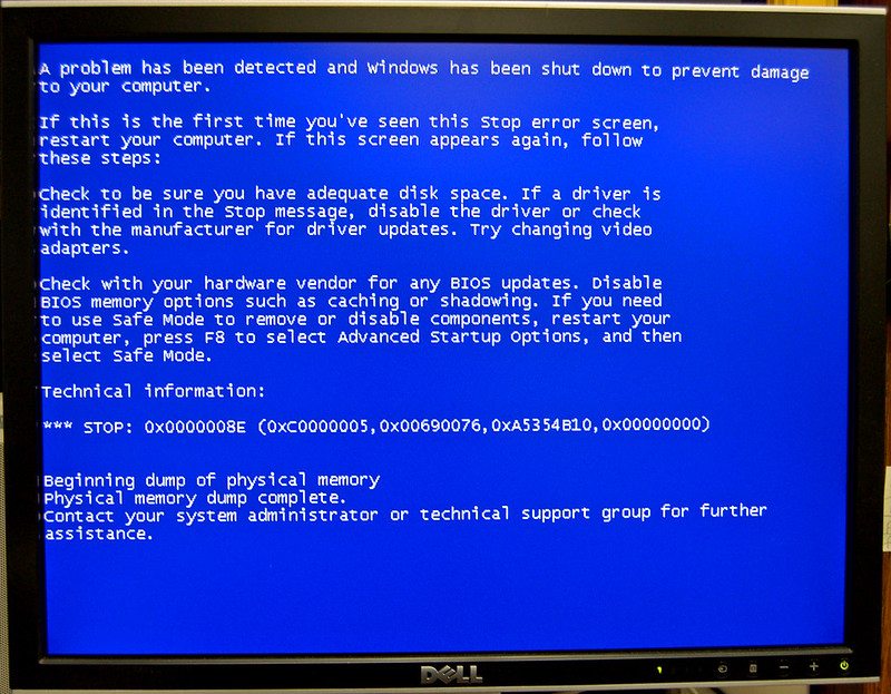 A Windows blue screen error displayed on a computer.